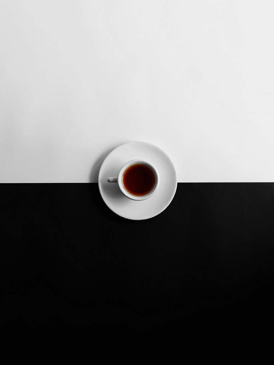 coffee cup flat view photography of cup of coffee pottery